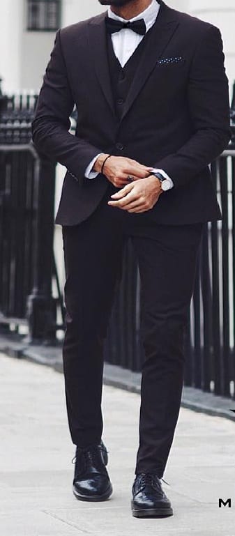 all black suit and bow tie