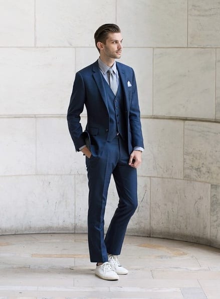 blue suit and sneakers