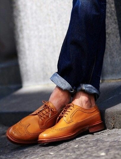 tan leather shoes paired with denims