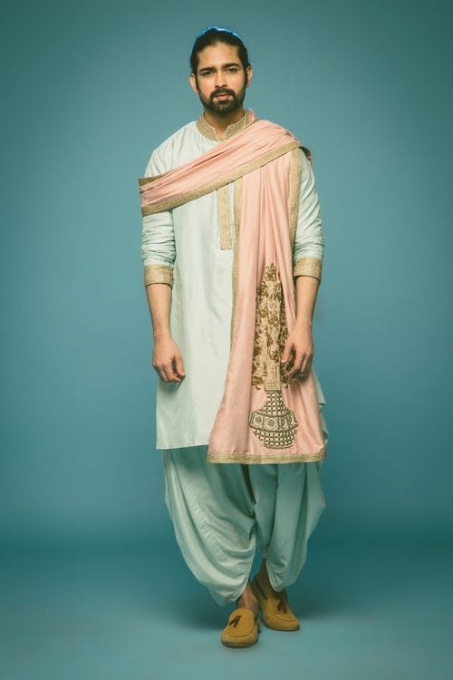 light blue kurta and dhoti styled with pink dupatta