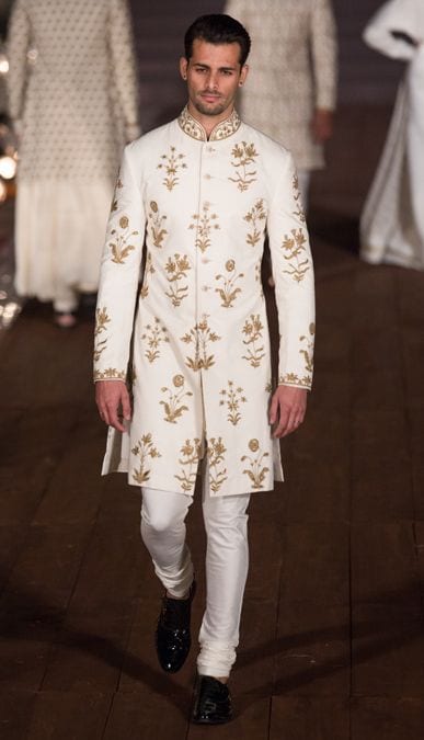 golden embroidery sherwani with plain pajama and black shoes