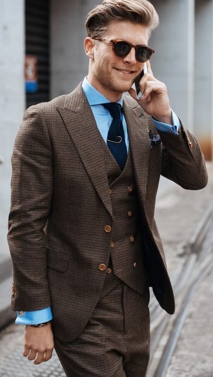 brown suit with blue shirt