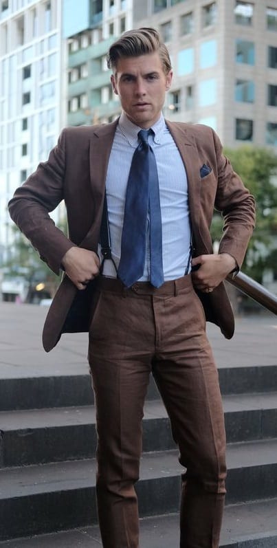 brown suit with light blue shirt and suspender