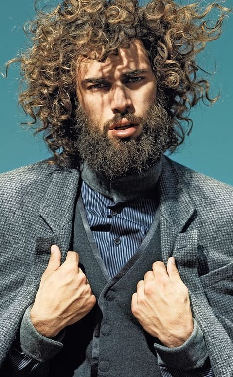 curly hairstyle and beard