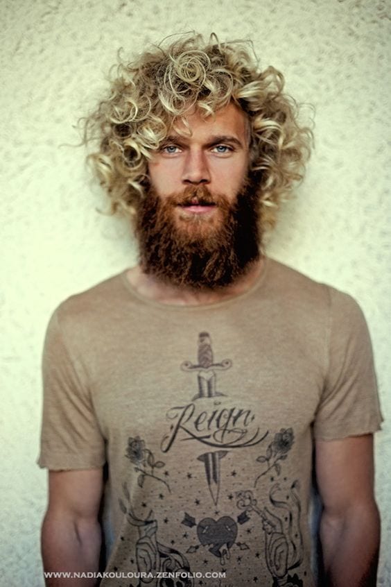 curly hairstyle with beard