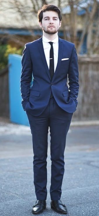 navy blue suit, black tie, black shoes