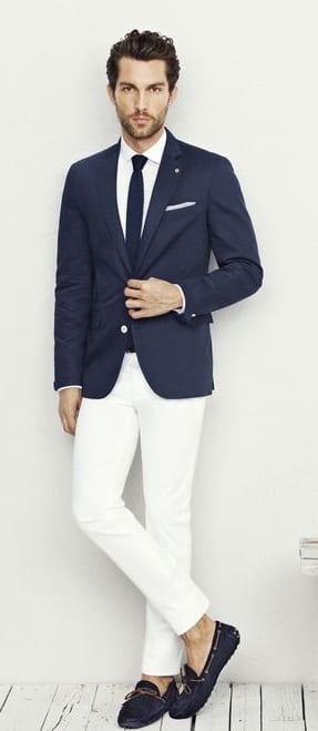 navy blue suit jacket with white trousers