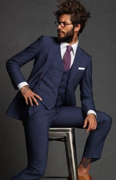 navy blue suit, messy hair