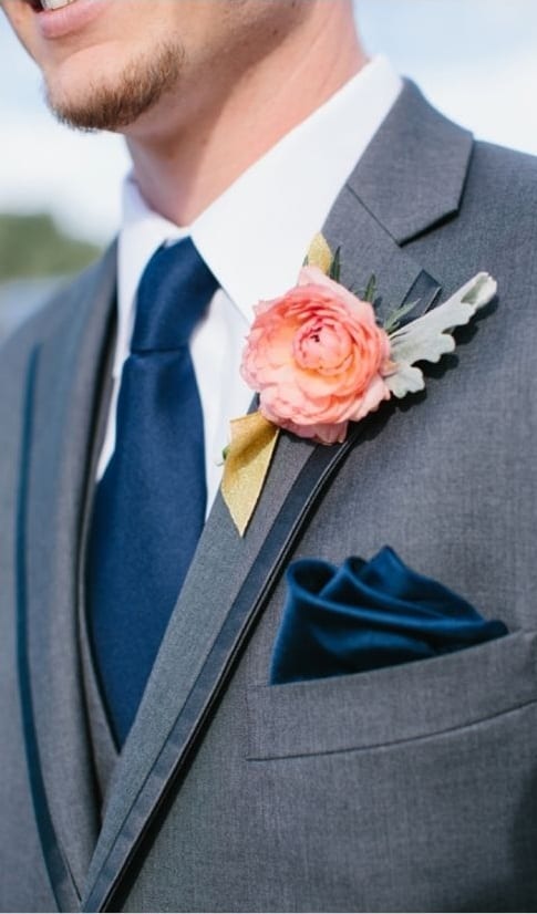 navy blue tie with lapel flower