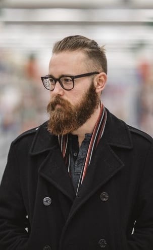 medium beard with slick back hair