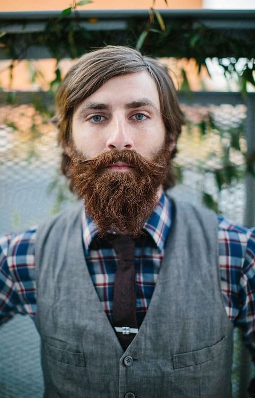 side part hairstyle with beard