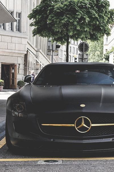 BLACK MERCEDES WITH GOLDEN LOGO