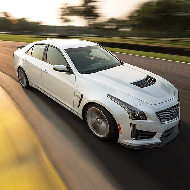 WHITE SPORTS CADILLAC SEDAN