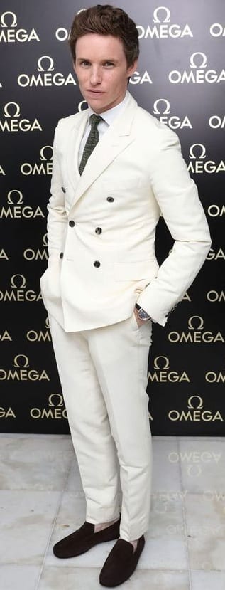 All white suit with black tie and loafers