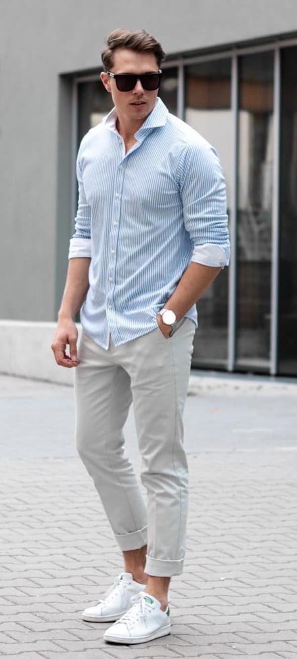 Blue shirt white sneakers and sunglasses