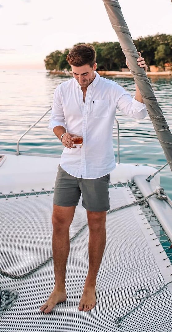 Grey shorts white shirt for yacht party