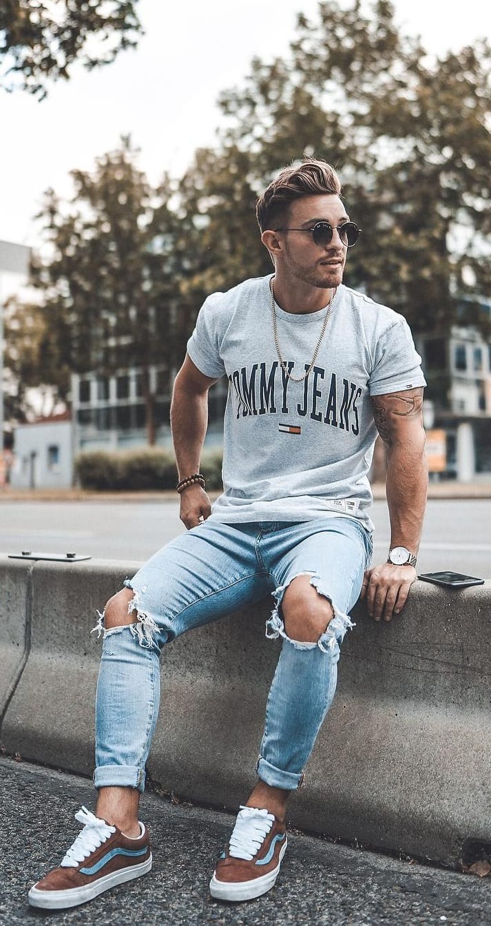 Grey t-shirt ripped denim and sunglasses