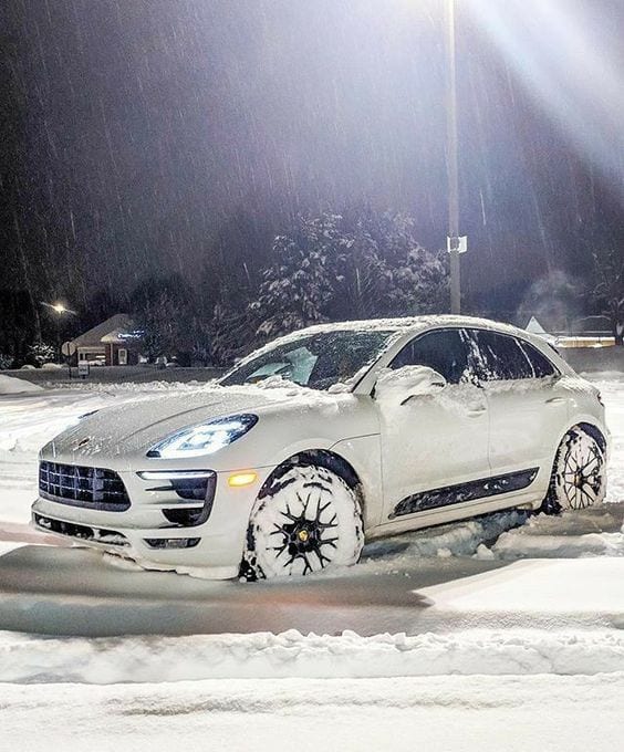 PORSCHE SUV IN SNOW