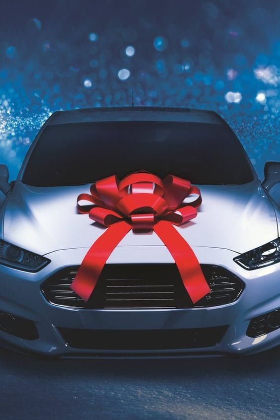 White car with bow for gift