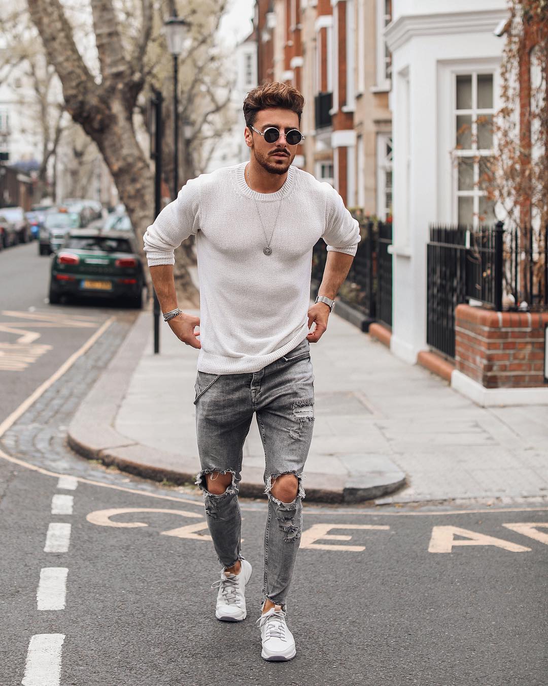 White t shirt,grey ripped jeans and black round sunglasses