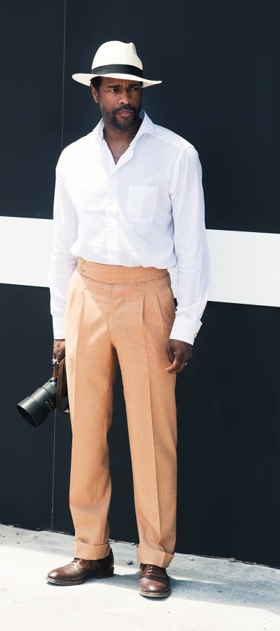 White shirt beige pant and white fedora