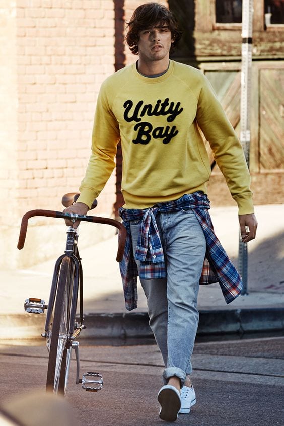 A-Hiking-Outfit-Yellow-Sweatshirt-wore-by-a-man-with-long-hair-white-Sneakers-1