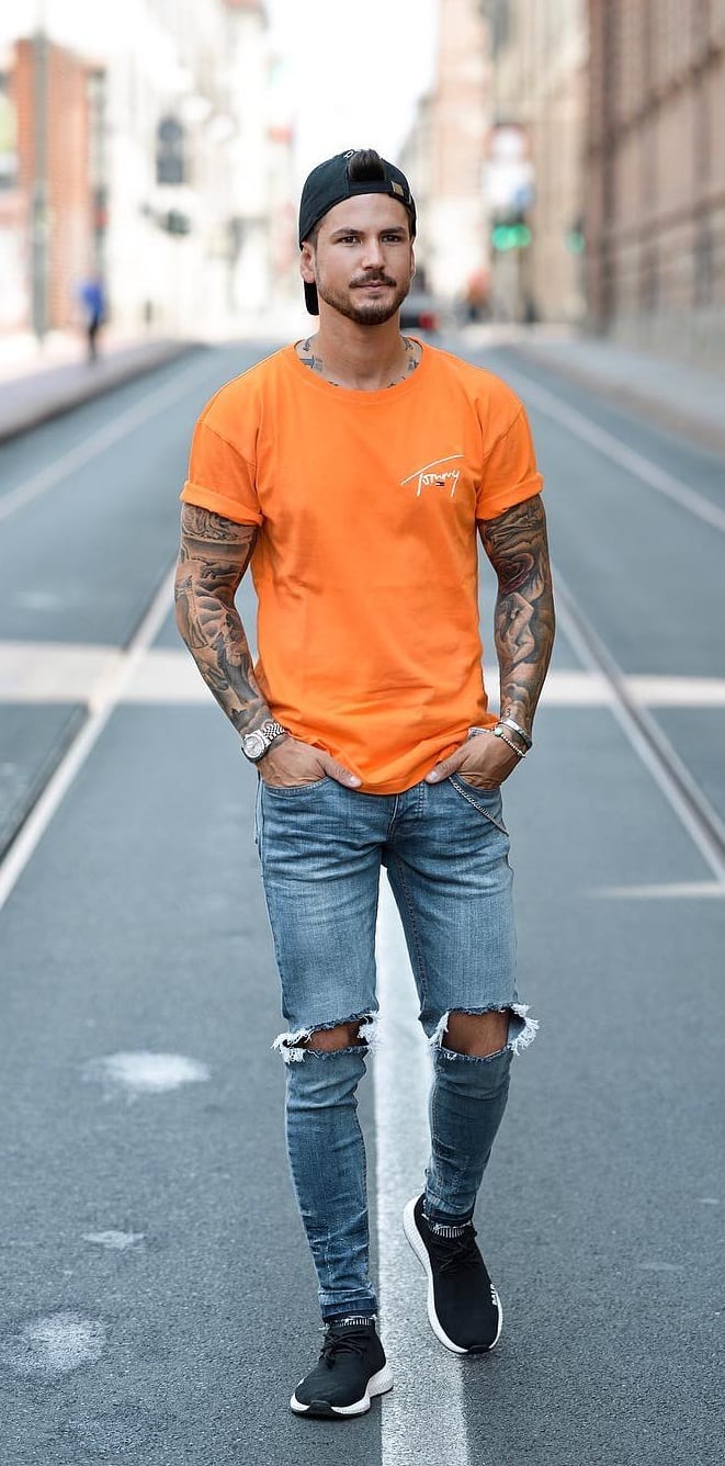 Orange-T-shirt-and-Blue-Ripped-Denims