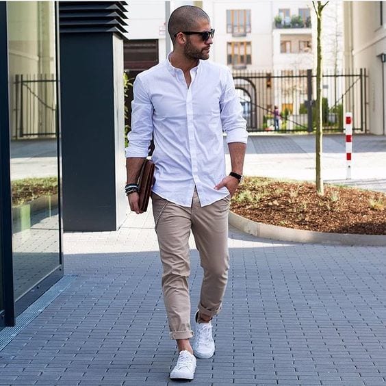 White-Sneakers-styled-with-White-Long-Sleeve-Shirt-Beige-Chinos-and-Dark-Brown-Leather-Zip-Pouch-1