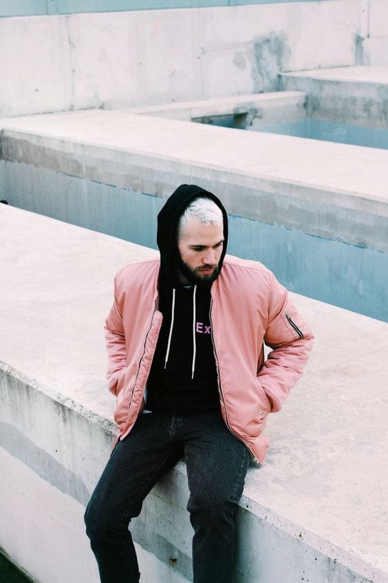 Stunning-Pink-Bomber-Jacket-Styled-with-Black-Hoodie-Denim-Jeans-and-one-can-complete-this-outfit-by-wearing-Black-Sneakers-1