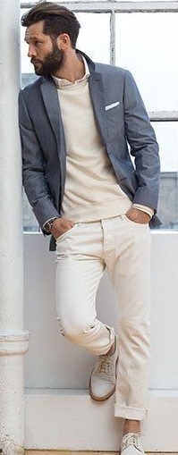 A inner shirt with cream t-shirt and grey suit. Has a white shoes and a watch_