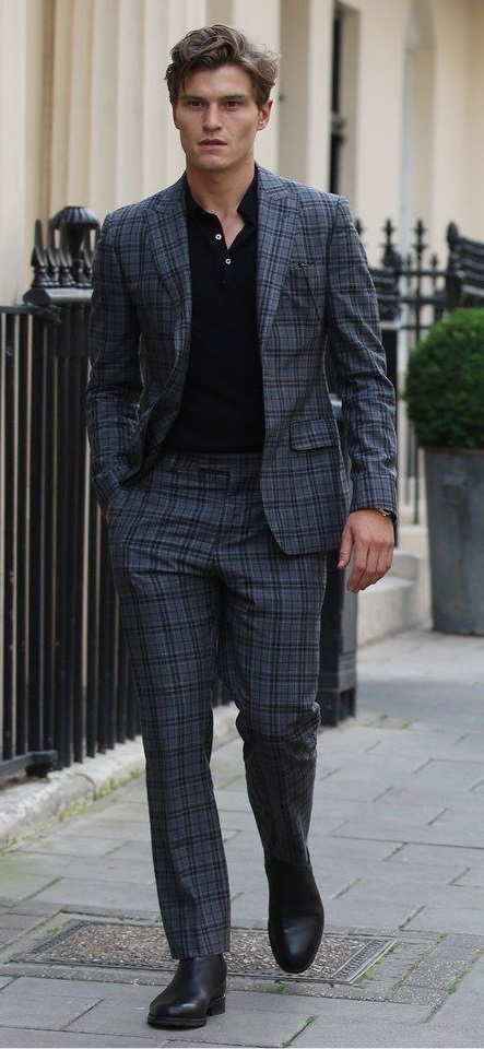 Black t-shirt with blue checkered suit and suede boots_