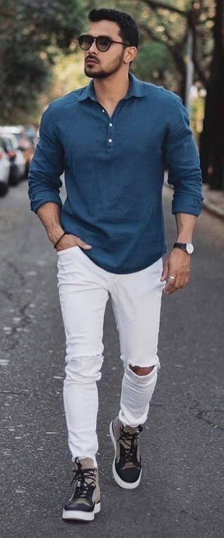 Full-sleeved t-shirt with ripped white jeans, accessorized with a watch