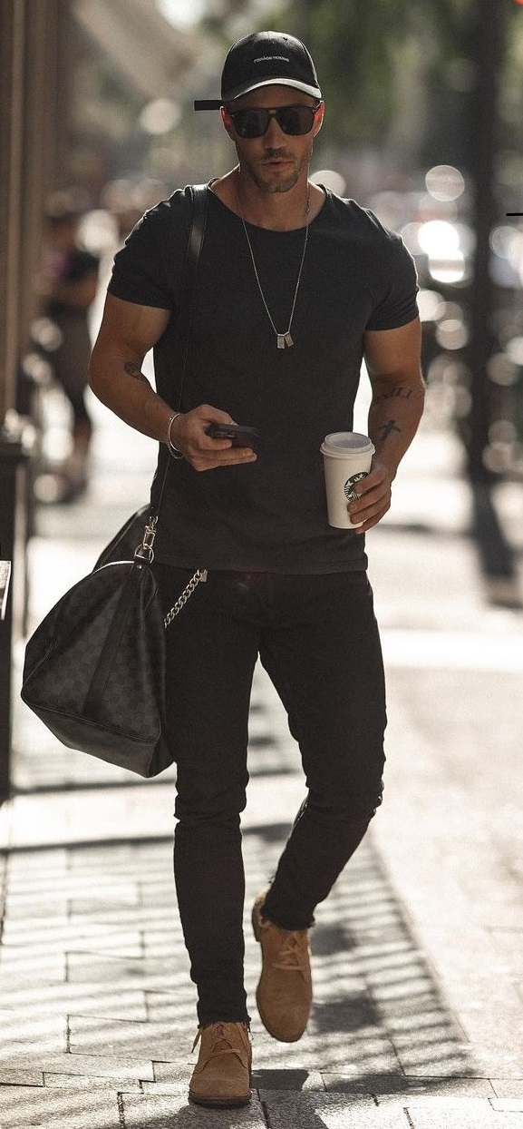 a whole black outfit with tshirt and accessorized with bags and shoes.jpg