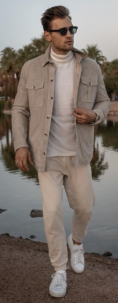 beige joggers with turtle neck t-shirt and light brown jacket with shades and white sneakers_