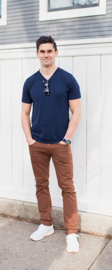 brown jeans with blue t-shirt with shades and a watch_