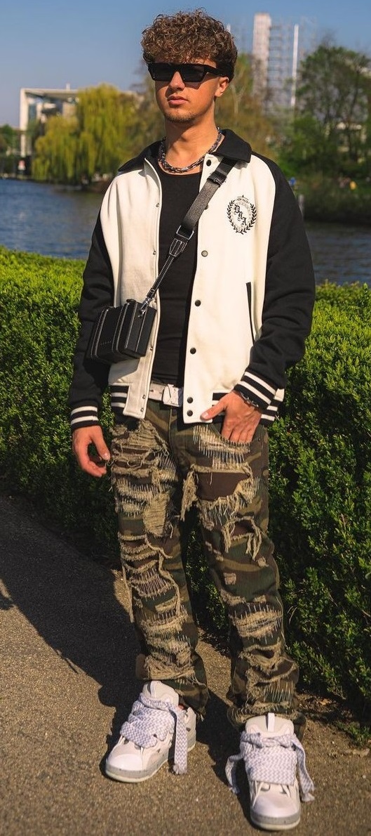 military printed shredded joggers with black tshirt and jacket paired with shoes