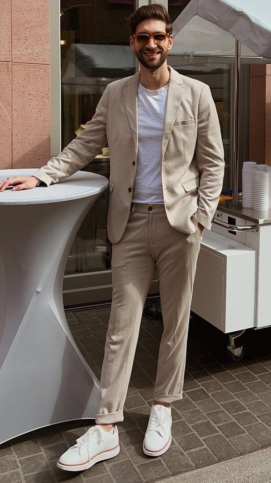 beige suit with white tshirt and sneakers for a smart causal outfit