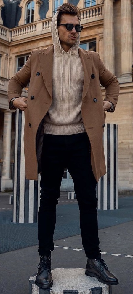 hoodie tshirt with brown overcoat and black chinos with long laced boots