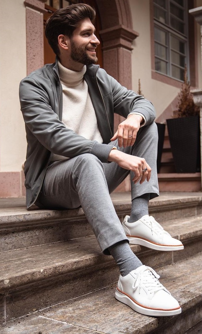 light grey suit with cream turtle neck tshirt and white sneakers