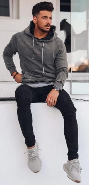 pullover grey hoodies with drawstring and a black denim which is been accessorized with a watch bracelet and a grey sneakers Best Fashion Blog For Men TheUnstitchd