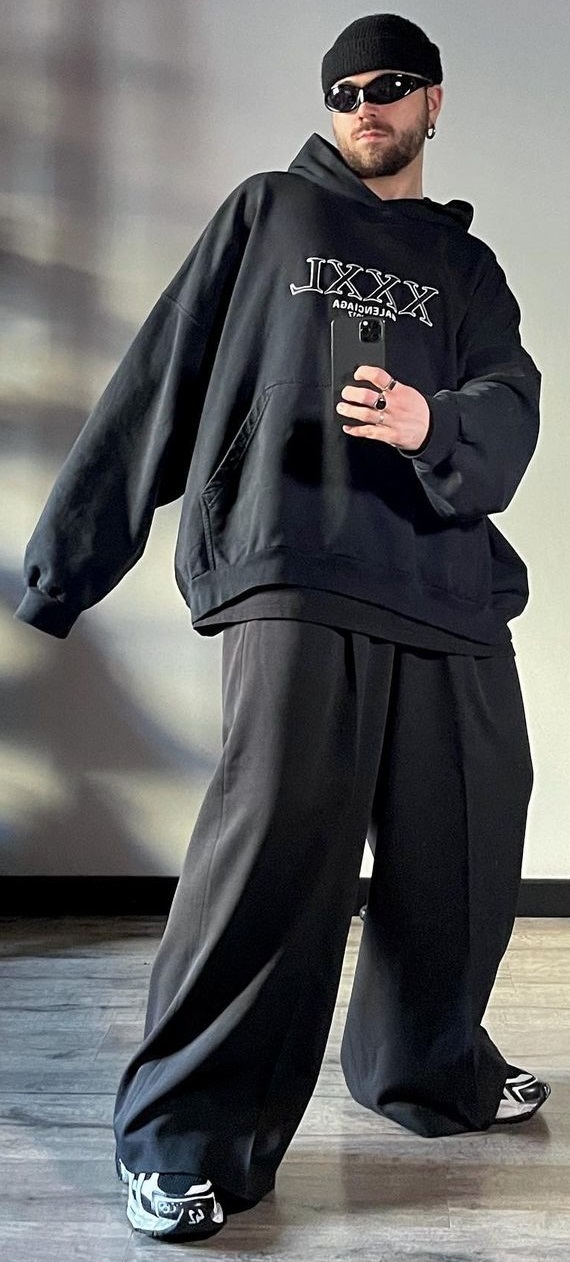 Balenciaga Oversized Hoodies with a baggy bottom accessorized with shades, a cap and rings, completing the look with sneakers being one of the must-have products to own