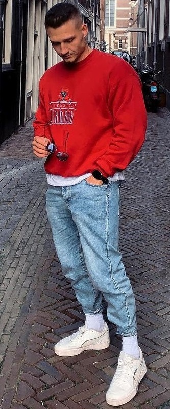 blue denims with a red sweatshirt with a sneaker brand - Puma