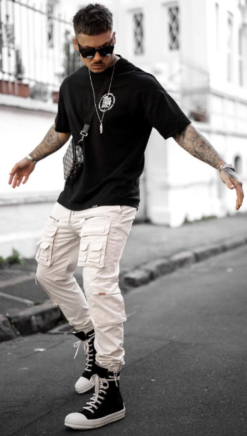 classic cargo pants of white color with black tshirt, accessorized with shades, locket and watch with shoes