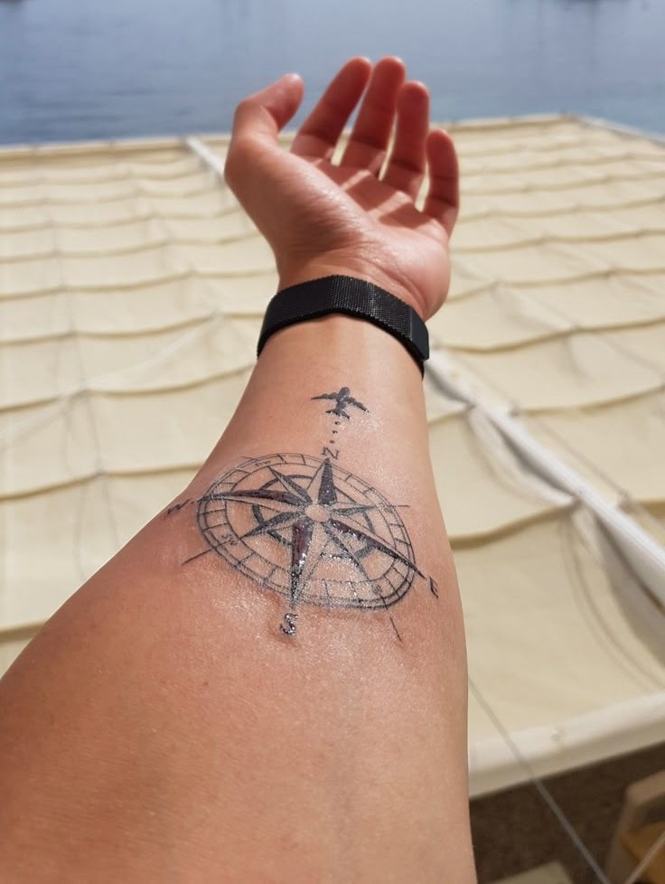 Compass Tattoo Symbolizes on Forearm