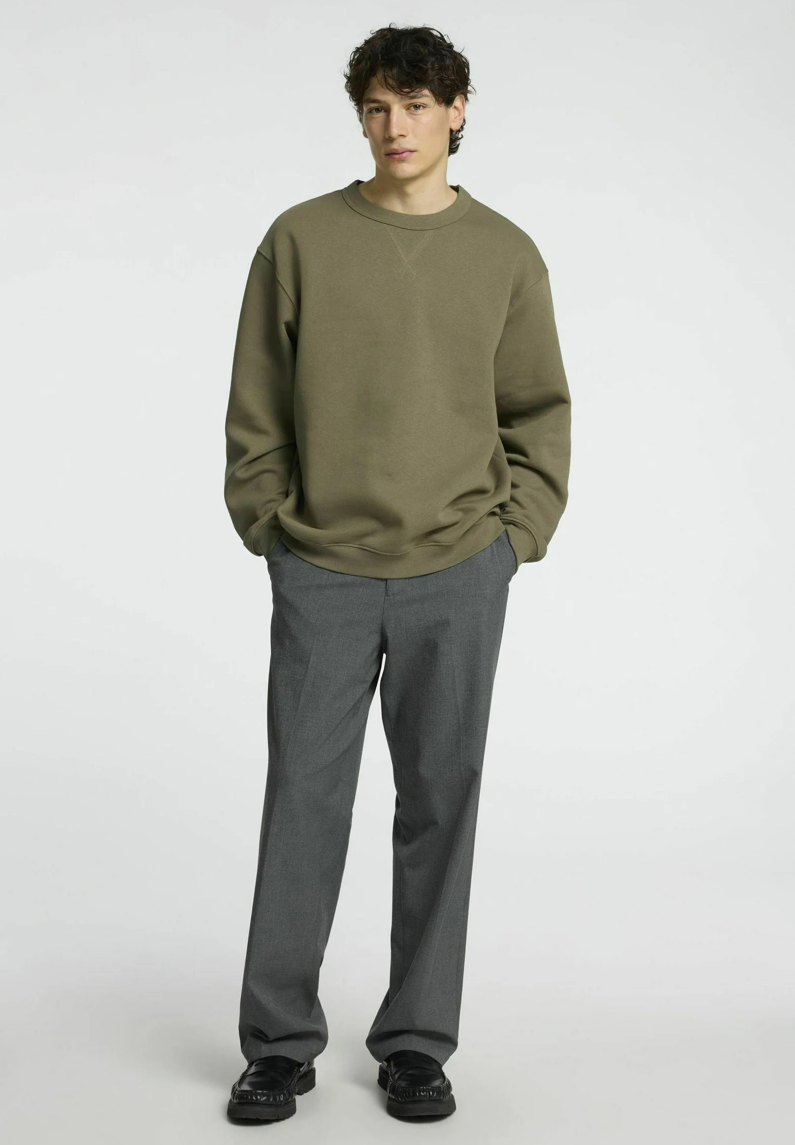 Sweatshirt Paired with Tailored Trousers
